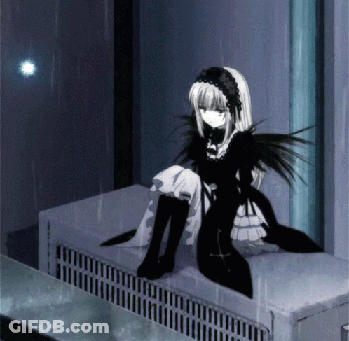 A Girl In A Black And White Dress Sits On A Radiator GIF