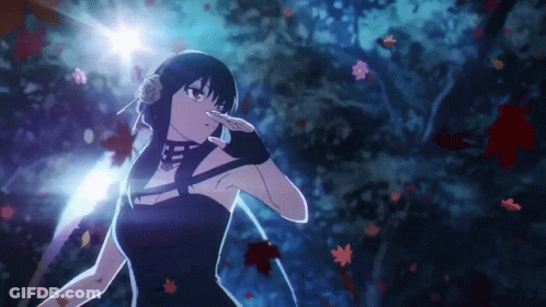 A Girl In A Black Dress Is Standing In A Dark Forest . GIF