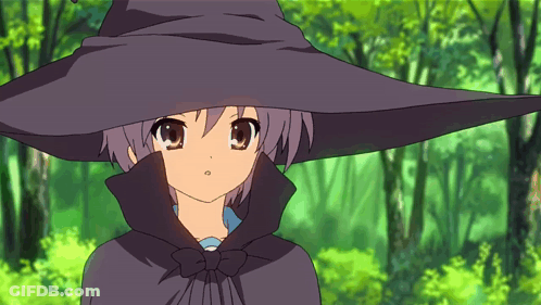 A Girl In A Black Witch Hat And Cape GIF