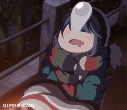 A Girl In A Blanket With A Light On Her Face GIF