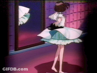 A Girl In A Blue And White Dress Stands In Front Of A Mirror GIF