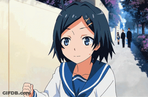 A Girl In A Blue And White Sailor Uniform Stands In Front Of A Fence GIF