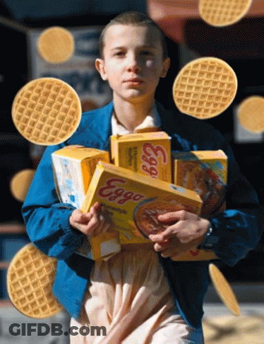 A Girl In A Blue Jacket Holds Boxes Of Eggs Cereal GIF