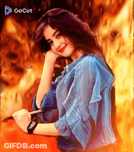 A Girl In A Blue Shirt Is Holding A Pen And Wearing A Smart Watch GIF