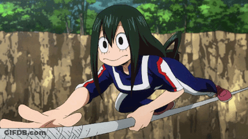 A Girl In A Blue Shirt With The Letter U On It Is Reaching For Something GIF