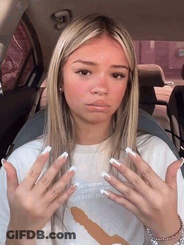 A Girl In A Car With A T-Shirt That Says " I Love You " GIF
