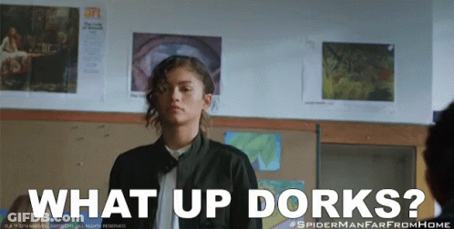 A Girl In A Classroom With The Words What Up Dorks Below Her GIF