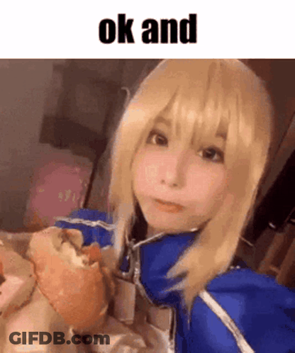 A Girl In A Cosplay Costume Is Eating A Hamburger And Making A Face . GIF