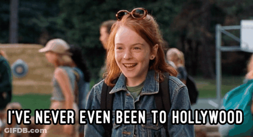 A Girl In A Denim Jacket Is Laughing And Says " I 'Ve Never Even Been To Hollywood " GIF