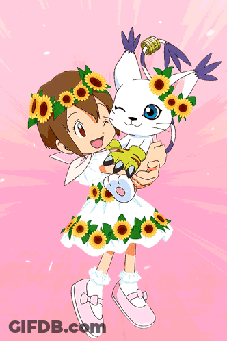 A Girl In A Dress With Sunflowers On It Holds A Cat GIF