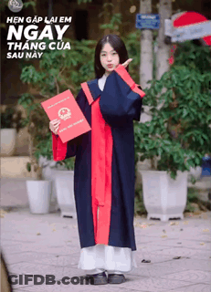 A Girl In A Graduation Gown Holds A Certificate GIF