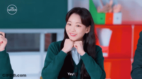 A Girl In A Green Shirt Says Yay GIF