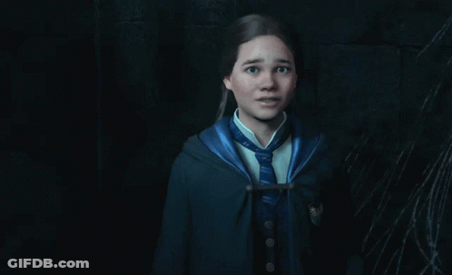 A Girl In A Harry Potter Uniform Is Standing In A Dark Room With A Spider Web In The Background GIF