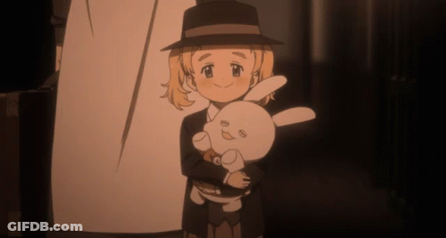 A Girl In A Hat Holds A Stuffed Rabbit GIF