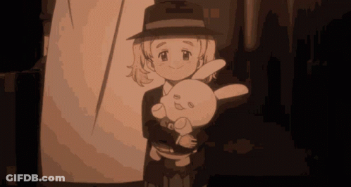 A Girl In A Hat Is Holding A Stuffed Animal GIF