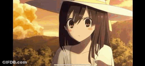 A Girl In A Hat Is Standing In A Field . GIF