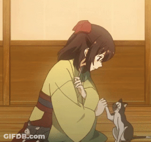A Girl In A Kimono Holds The Paw Of A Cat GIF