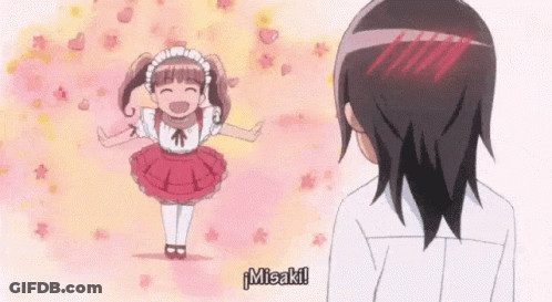 A Girl In A Maid Costume Is Standing Next To A Man . GIF