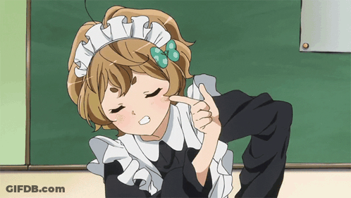 A Girl In A Maid Outfit Is Pointing To Her Face GIF