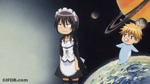 A Girl In A Maid Outfit Stands Next To A Boy In A Diaper GIF