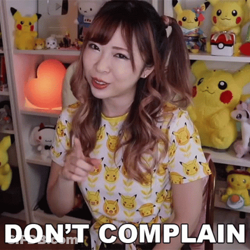 A Girl In A Pikachu Shirt Says " Do N't Complain " In Front Of Stuffed Pikachus GIF