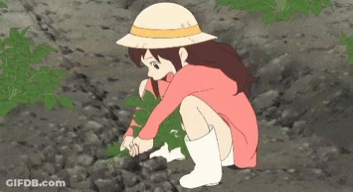 A Girl In A Pink Dress And White Boots Is Kneeling Down Picking Leaves GIF