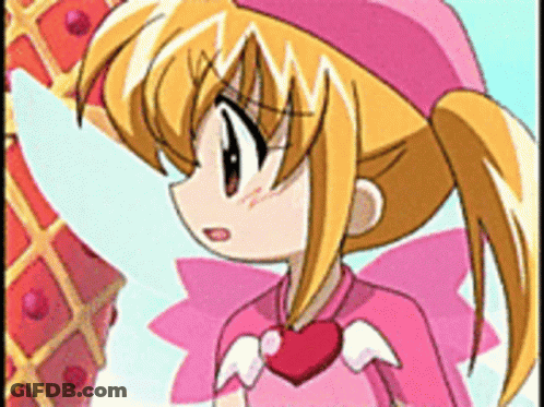 A Girl In A Pink Outfit With A Heart Around Her Neck GIF
