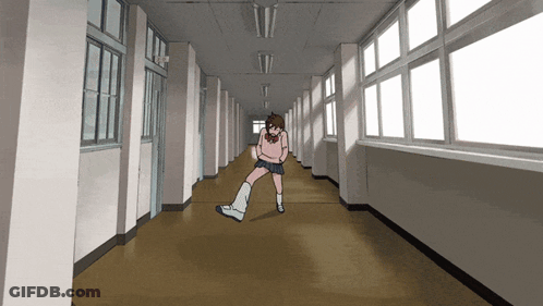 A Girl In A Pink Shirt And Shorts Is Dancing In A Hallway GIF