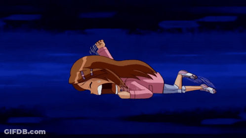 A Girl In A Pink Shirt Is Laying On Her Stomach With Her Eyes Closed GIF