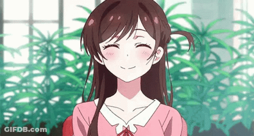 A Girl In A Pink Shirt Is Smiling With Her Eyes Closed In Front Of A Window . GIF