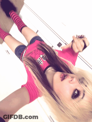 A Girl In A Pink Shirt With The Number 10 On It Is Laying On The Floor GIF