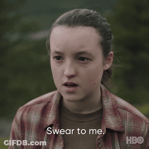 A Girl In A Plaid Shirt Is Making A Swear To Me Face GIF