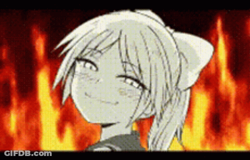 A Girl In A Ponytail Is Smiling In Front Of A Fire . GIF