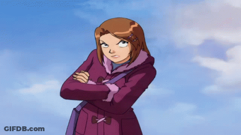 A Girl In A Purple Coat Has Her Arms Crossed And Looks Angry GIF