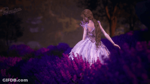 A Girl In A Purple Dress Is Holding A Bouquet Of Purple Flowers . GIF