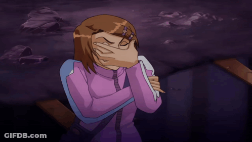 A Girl In A Purple Shirt Is Covering Her Face With A Towel GIF