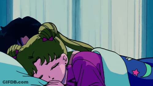 A Girl In A Purple Shirt Is Sleeping On A Bed GIF