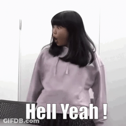 A Girl In A Purple Sweatshirt Is Standing In Front Of A Wall And Saying `` Hell Yeah ! '' GIF