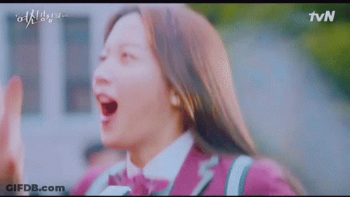 A Girl In A Purple Uniform Is Giving A High Five To Someone . GIF