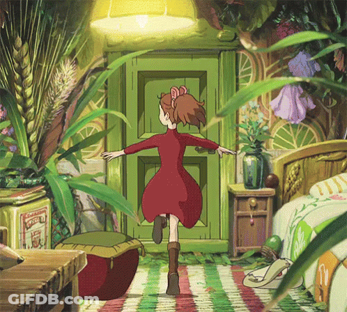 A Girl In A Red Dress Is Standing In Front Of A Green Door Surrounded By Plants . GIF