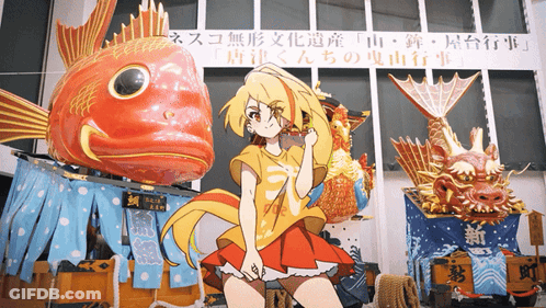 A Girl In A Red Dress Is Standing In Front Of A Large Fish Statue GIF