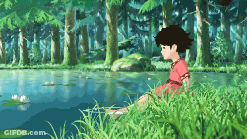 A Girl In A Red Dress Sits In The Grass Near A Pond GIF