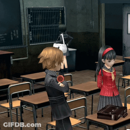 A Girl In A Red Dress Stands In A Classroom With A Boy GIF