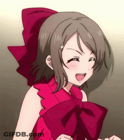 A Girl In A Red Dress With A Bow On Her Head GIF