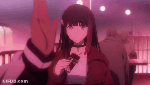 A Girl In A Red Jacket Is Holding A Chocolate Bar That Says ' Cocoa ' On It GIF