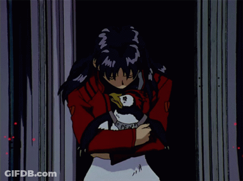A Girl In A Red Jacket Is Holding A Penguin With A Necklace That Says Peace GIF