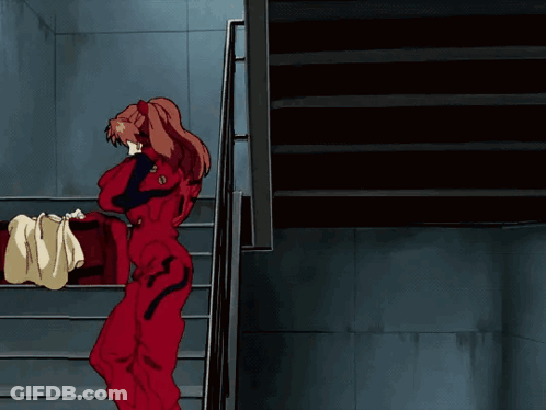Girl In Red Jumpsuit Walking Down Stairs GIF