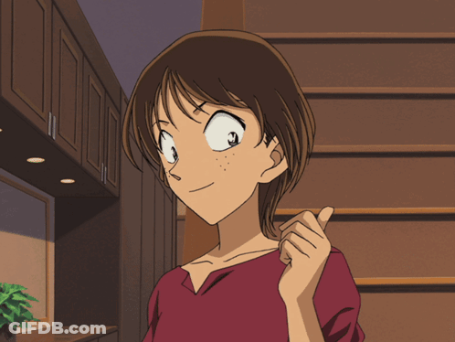 A Girl In A Red Shirt Is Pointing At Something GIF