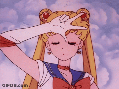 A Girl In A Sailor Suit Is Making A Peace Sign With Her Finger GIF