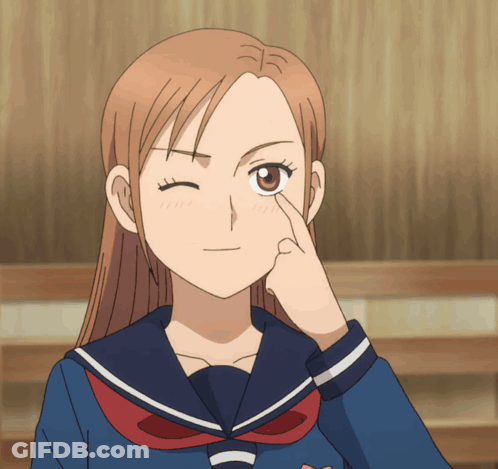 A Girl In A Sailor Suit Winks Her Eye GIF